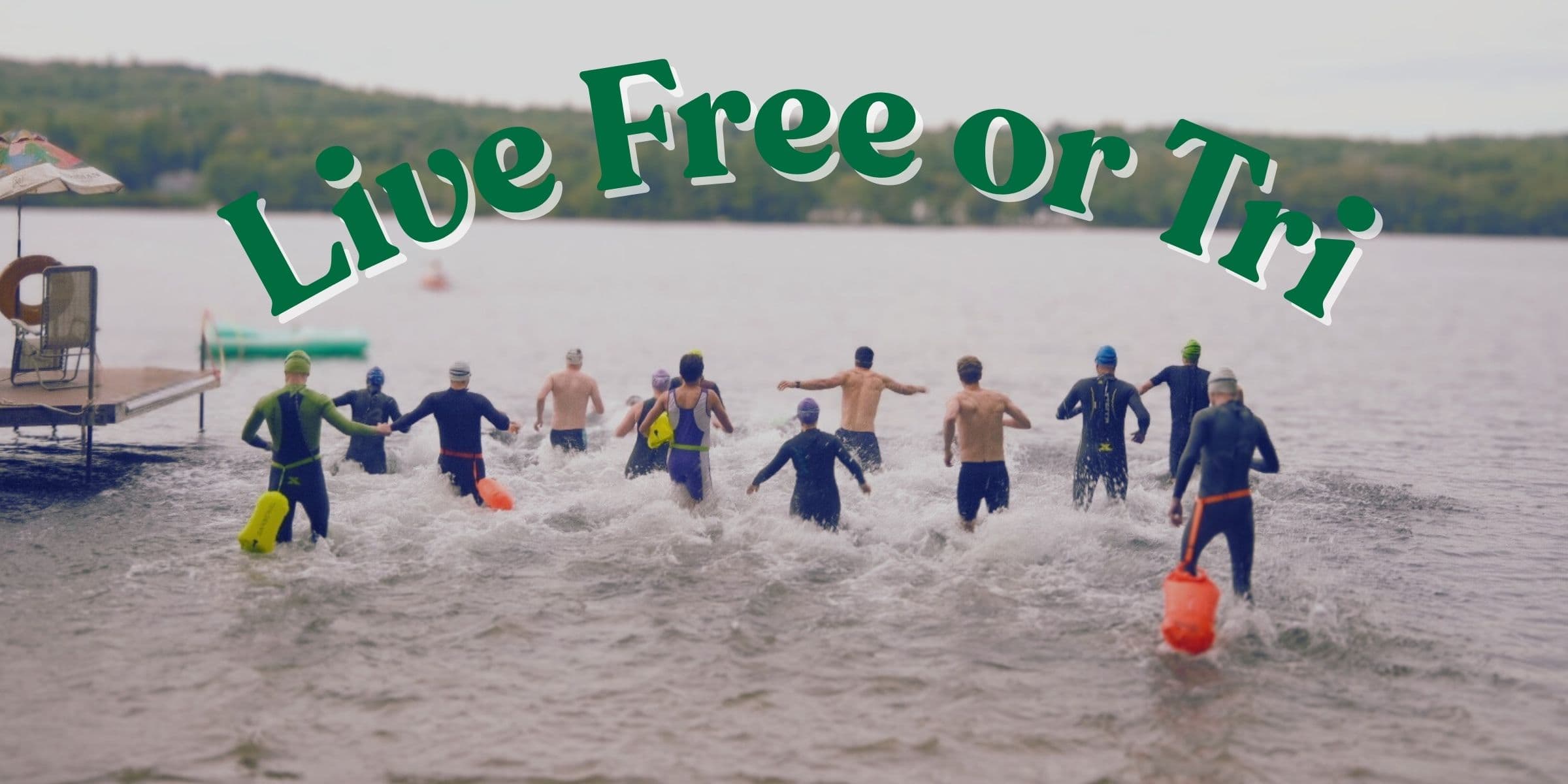 Triathletes running into the lake at the Meredith TryAthlon